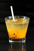 Passion Fruit Smoothie, drink with passion fruit pulp, vodka, sugar and ice photo