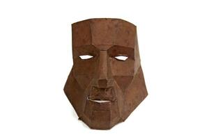 cardboard mask on white background photo