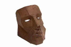 cardboard mask on white background photo