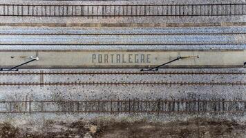 Aerial view of Portalegre written in traditional Portuguese pavement at the Portalegre railway station. Captured by a drone, this unique perspective showcases the intricate stonework photo
