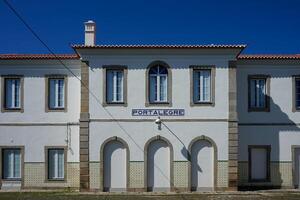 Portalegre, Portugal. May 19, 2024. A tranquil view of Portalegre Railway Station in Portugal, showcasing its charming architecture with classic white and yellow hues. photo