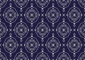 White geometric and symbol flowers design on dark blue background, ethnic fabric seamless pattern design for cloth, carpet, batik, wallpaper, wrapping etc. vector