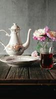 Serving breakfast with black tea and sandwiches with currant jam. Stop motion animation. Vertical. Hand knocks on a glass mug and tea appears, sandwiches with jam appear on a plate video