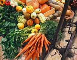 assorted vegetables and vegetables on wooden cart photo