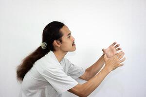 Annoyed and angry man raising hands and clench teeth outraged, going to kill someone. photo