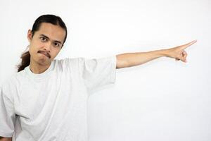 Upset and angry man with hand pointing to another direction, isolated on white background. photo