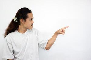 Upset and angry man with hand pointing to another direction, isolated on white background. photo