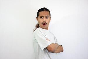 Annoyed and angry man with folded hands. looking at the camera angrily. isolated on white background photo