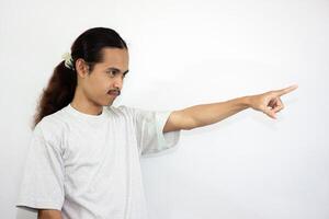 Upset and angry man with hand pointing to another direction, isolated on white background. photo