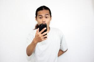Asian man with various expressions while holding mobile phone. isolated in white background photo