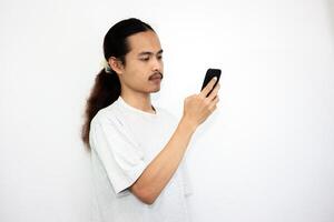 Asian man with various expressions while holding mobile phone. isolated in white background photo
