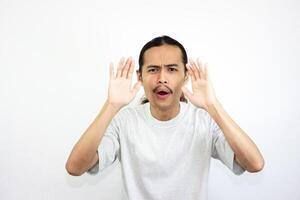 Surprised Asian man. isolated in white background photo