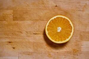 Slices of orange on a cutting board photo