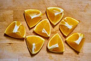Slices of orange on a cutting board photo