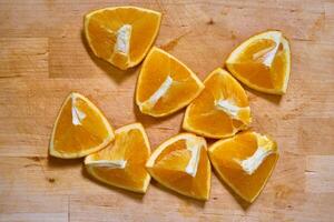 Slices of orange on a cutting board photo