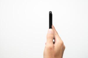 Man's hand holding a smart phone screen view from above. isolated in white background photo