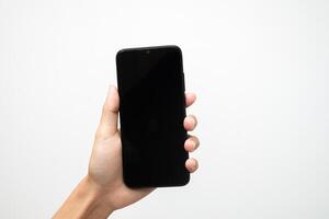 Man's hand holding a smart phone screen view from above. isolated in white background photo