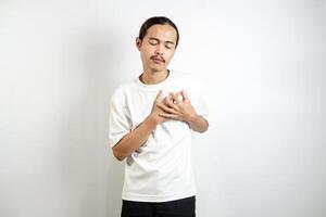 A young man clutched his chest. Severe pain, shortness of breath, panic attacks, heart attacks, strokes. isolated in white background photo