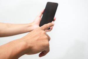 Man's hand holding a smart phone screen view from above. isolated in white background photo