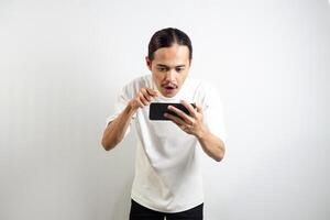 Asian man with various expressions while holding mobile phone. isolated in white background photo