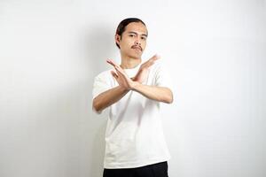 Young man wearing a white t-shirt. make movements not with your hands. crossed arms. There isn't any. sign isolated on white background photo