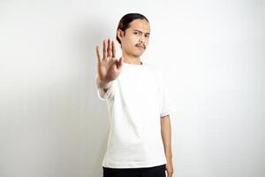 Young man wearing a white t-shirt. make movements not with your hands. crossed arms. There isn't any. sign isolated on white background photo