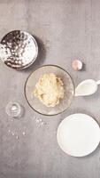 Strawberry galette cooking process. Stop motion animation. Vertical. Ingredients are mixing into dough, cream and strawberries appearing, table is serving with galette, tea and honey video
