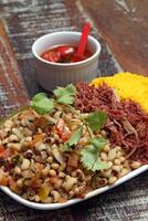 String beans, dried meat and farofa photo