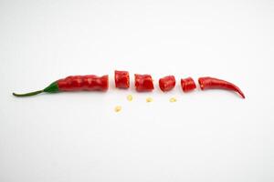 Large red chili slices. isolated in white background photo