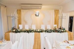 an image of tables setting at a luxury wedding hall photo