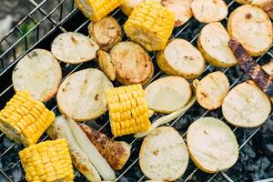 Various vegetables are baked, barbecue grill, outdoors, selective focus. Vegetarian vegetable barbecue concept, photo