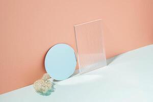 Creative minimalistic podium background various materials, glass mirror, blue coral pastel background photo