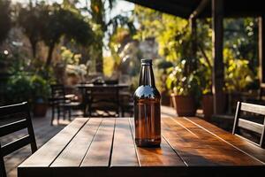 One bottle of dark beer is on the table. photo