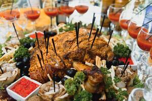Meat and cheese appetizers. Antipasti and catering platter with different meat and cheese products. photo
