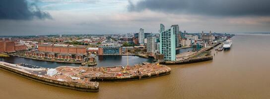 Liverpool, Merseyside, England September 20th, 2021 Aerial view of Liverpool Skyline and the Mersey river. Construction site near Waterfront photo