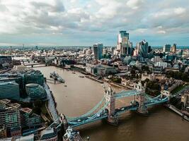 Aerial view to the Tower Bridge and London city Business center , UK, just before sunset. Traffic going across the bridge. photo
