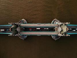 Aerial top down view to the iconic Tower Bridge over river Thames from drone. Traffic going across the bridge. photo