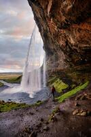 Stunning Seljalandsfoss Waterfall at Sunset, One of Icelands Most Popular and Breathtaking Natural Wonders photo