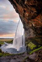 Stunning Seljalandsfoss Waterfall at Sunset, One of Icelands Most Popular and Breathtaking Natural Wonders photo
