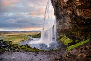 Stunning Seljalandsfoss Waterfall at Sunset, One of Icelands Most Popular and Breathtaking Natural Wonders photo