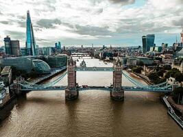 Aerial view of the Tower Bridge in London. One of London's most famous bridges and must see landmarks in London. Beautiful panorama of London Tower Bridge. photo