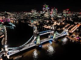 Aerial drone view of London Tower Bridge at night City center and the River Thames, England, United Kingdom photo
