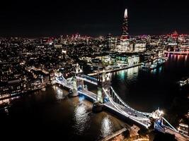 Stunning panorama view over Thames river in night the Shard, the London skyline, Tower Bridge and cityscape. Aerial photo over the big city at night