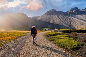 Traveler walking towards the Viking Village in East Iceland photo