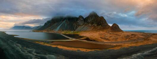 Drone view of a snow covered Eystrahorn mountain in Iceland at Hvalnes peninsula photo