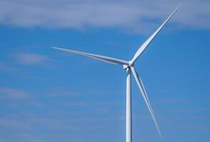 Wind energy and sustainable power generation with wind turbines, Eco-friendly solutions for renewable resources. Wind power farm and sustainable development of renewable energy, green technology. photo