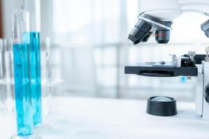Scientist analyze biochemical samples in advanced scientific laboratory. Medical professional use microscope look microbiological developmental of viral. Biotechnology research in science lab. photo