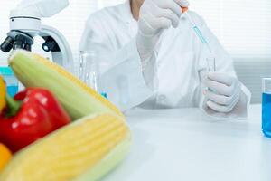 Scientist check chemical food residues in laboratory. Control experts inspect quality of fruits, vegetables. lab, hazards, ROHs, find prohibited substances, contaminate, Microscope, Microbiologist photo