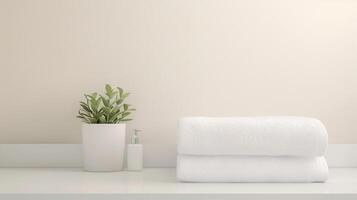 Tranquil Minimalist Bathroom Decor with White Towels, Potted Plant, and Soap Dispenser on White Countertop photo
