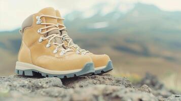 Sturdy Hiking Boots on Rocky Terrain with Mountain View in Background, Perfect for Outdoor Adventure and Nature Enthusiasts photo